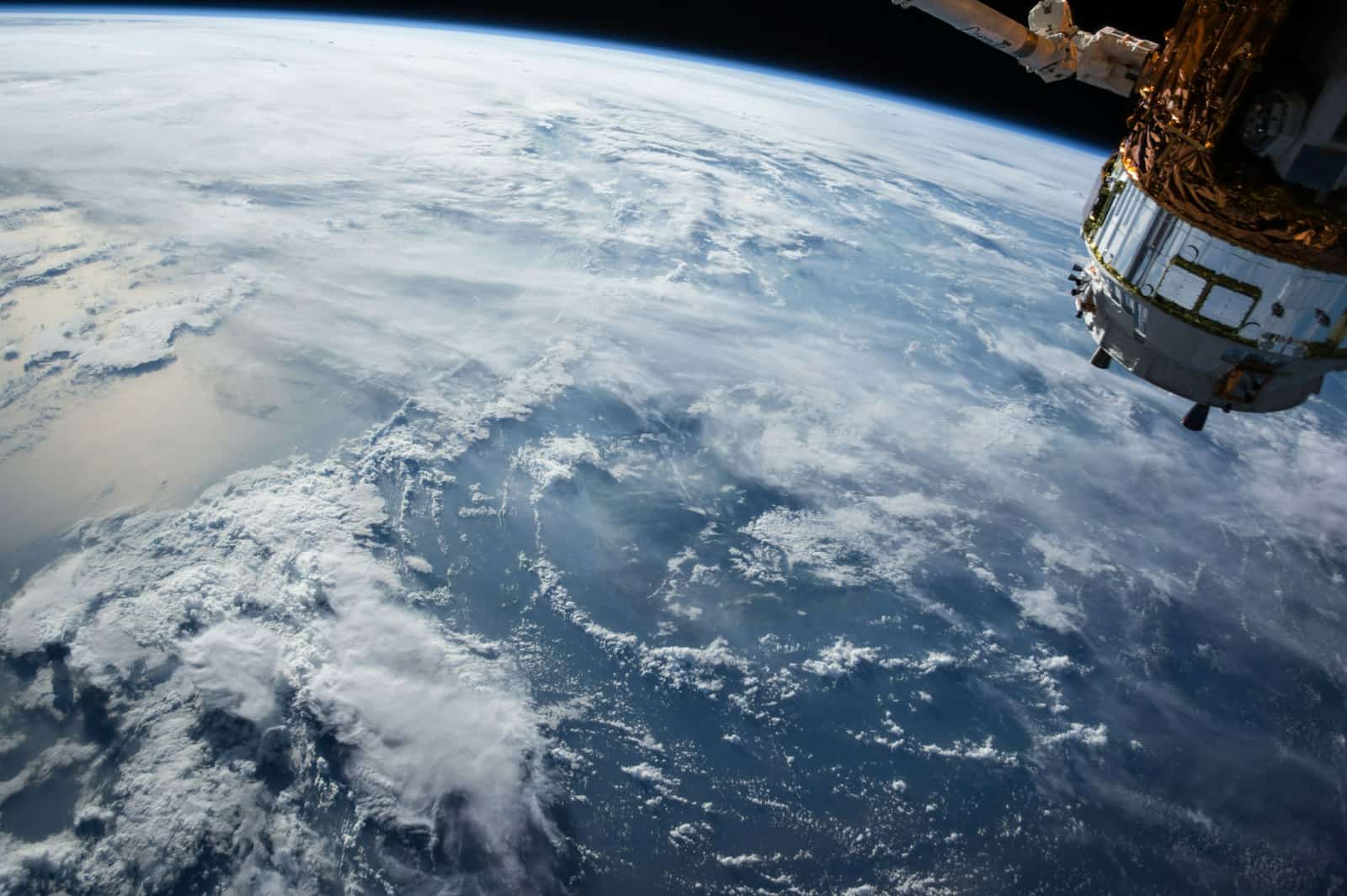 The curve of Earth from orbit against the black of space
